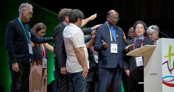 1 September 2022, Karlsruhe, Germany: The Rev. Dr. Jerry Pillay, the general secretary elect of the World Council of Churches, is blessed by leaders of the Reformed community in a confessional gathering during the 11th Assembly of the World Council of Churches, held in Karlsruhe, Germany.